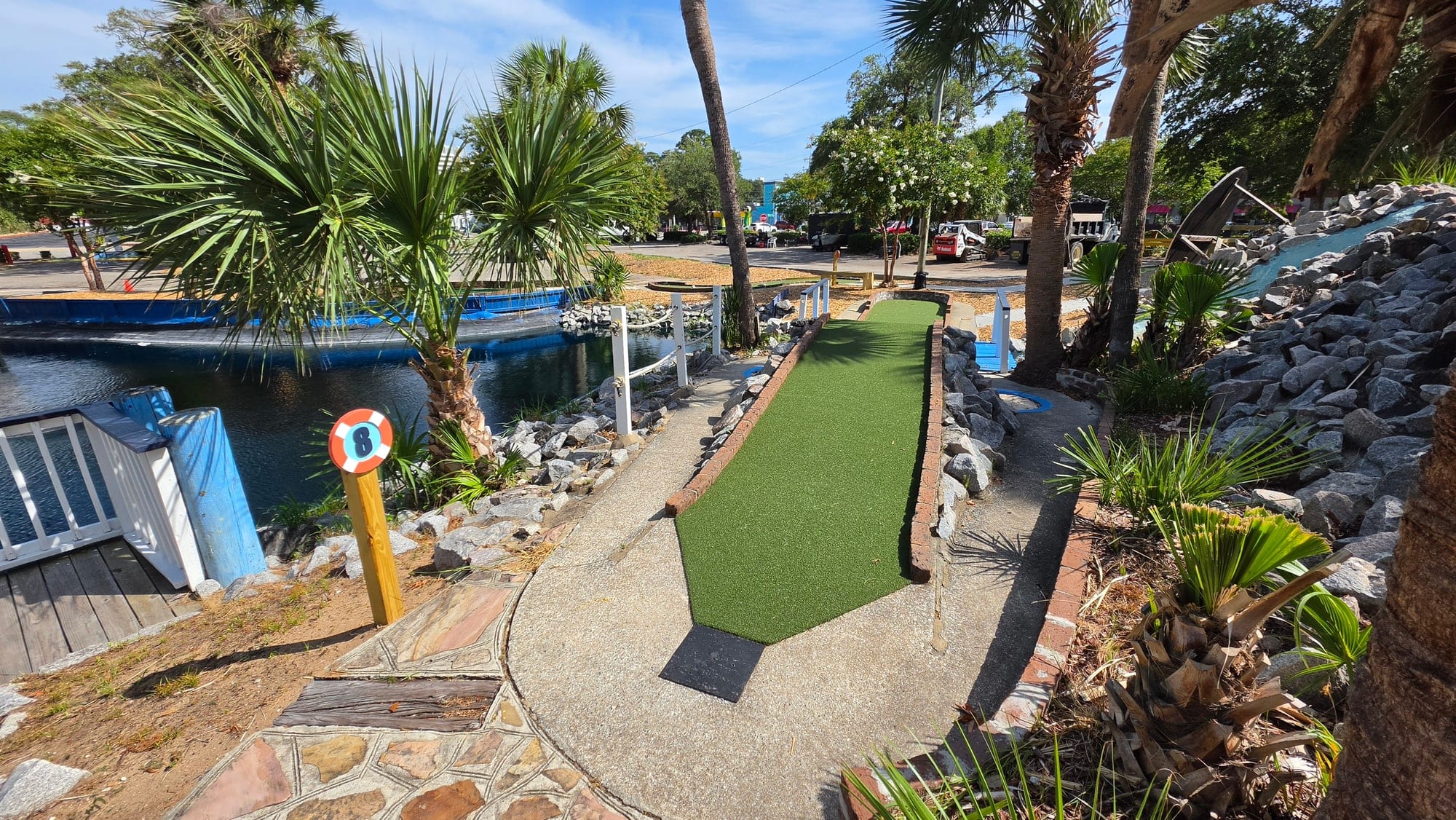 Hole 8 putting green beside the water at Captain Myrtle Mini Golf